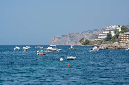 MAJORCA COAST, BALEARIC ISLANDS, SPAIN - JULY 19, 2014: Boats near Santa Ponsa and the hotel Punta del Mar on July 19, 2014 in Majorca, Spain.のeditorial素材