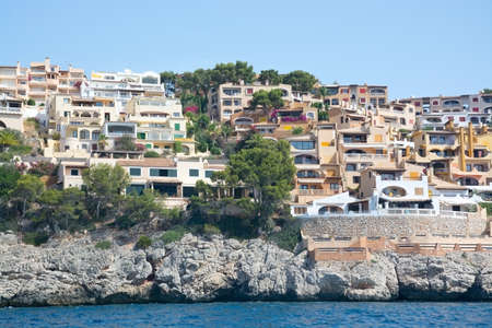 MAJORCA COAST, BALEARIC ISLANDS, SPAIN - JULY 19, 2014: Charming hotels and apartment buildings from the sea near Cala Fornells on July 19, 2014 in southwest Majorca, Spain.のeditorial素材