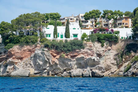 MAJORCA COAST, BALEARIC ISLANDS, SPAIN - JULY 19, 2014: Charming hotels and apartment buildings from the sea near Cala Fornells on July 19, 2014 in southwest Majorca, Spain.のeditorial素材