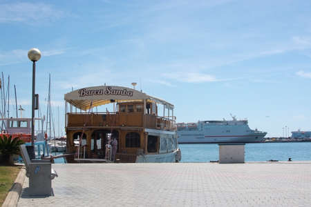 PALMA DE MALLORCA SPAIN  APRIL 21 2015: Tour boat in harbor preparing for tourist season on April 21 2015 in Palma de Mallorca Balearic islands Spain.のeditorial素材