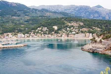 PORT DE SOLLER, MALLORCA, SPAIN - APRIL 22, 2015: Bay view of the small village from the inlet on April 22, 2015 in Port de Soller, Mallorca, Balearic islands, Spain.のeditorial素材