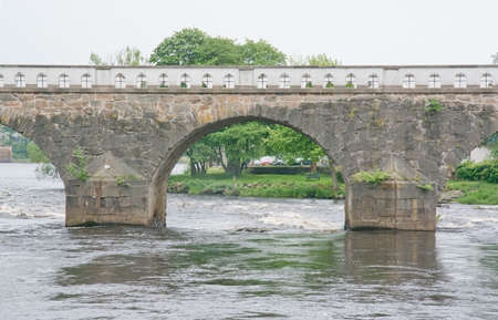 FALKENBERG, SWEDEN - JUNE 6, 2015: Old stone toll bridge on June 6, 2015 in Falkenberg, Sweden.のeditorial素材