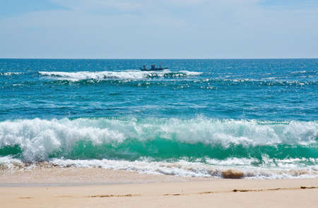 Green wave whith white seafoam closeup on sandy paradise beach Sri Lanka Asia.の写真素材
