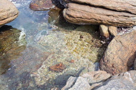 Metamorphic pebbles and boulders underwater in Southern Province Sri Lanka Asia.の写真素材