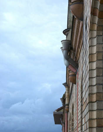 Rooftop closeup and sky with clouds architectural detail.の写真素材