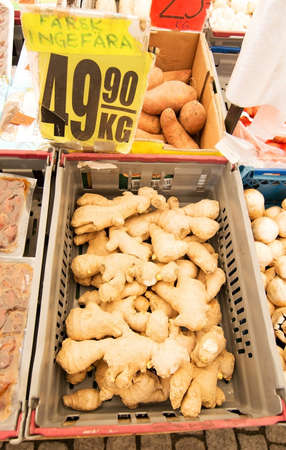 VALLINGBY, STOCKHOLM, SWEDEN - JULY 9, 2015: Fresh ginger closeup. Heap of fresh ginger closeup on display in the market inside a tent on July 9, 2015 in Vallingby, Stockholm, Sweden.のeditorial素材