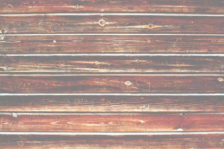 Scratched wood plank background texture with torn, vintage grungy distressed surface.の写真素材
