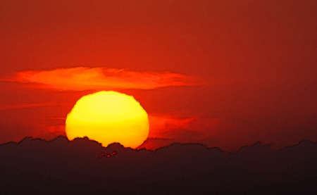 Red sunset into the Mediterranean from the west coast of Mallorca, Balearic islands, Spain in July.