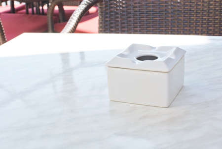 Ashtray on table in outdoor restaurant in Mallorca, Balearic islands, Spain in July.の写真素材