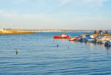 CAN PASTILLA, MAJORCA, BALEARIC ISLANDS, SPAIN - JULY 26, 2015: Small boats moored in the Cala Estancia marina on a sunny summer afternoon on July 26, 2015 in Mallorca, Balearic islands, Spain.のeditorial素材