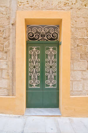 Green wooden door. Painted doors of Malta series.の写真素材