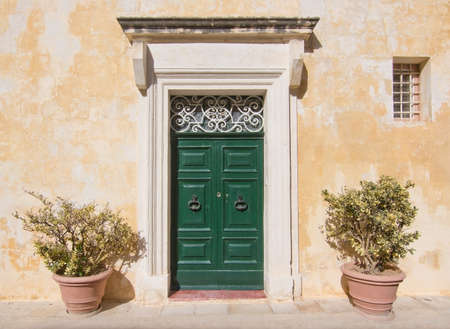 Green wooden door. Painted doors of Malta series.の写真素材