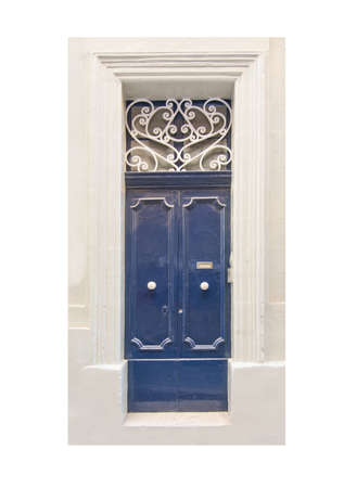 Blue painted door with white wrought iron pattern and white knobs. Painted Maltese front doors.の写真素材