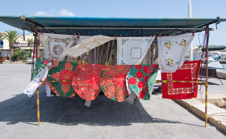 MARSAXLOKK, MALTA - SEPTEMBER 15, 2015: Shopping market display with beautiful handicraft...
