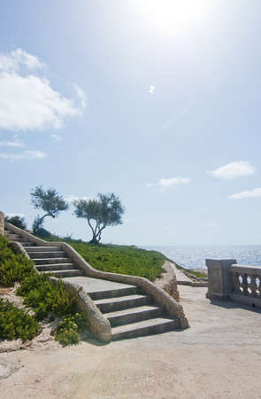 Park with trees and stairs coastal viewpoint near popular tourist attraction Blue Grotto on a sunny day in September 15, 2015 in Malta.の写真素材