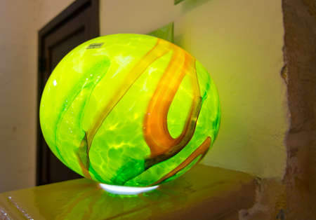 MDINA, MALTA - SEPTEMBER 15, 2015: Handblown glass lamp in green made by artisans in Mdina on display in Mdina glass store on September 14, 2015 in Mdina, Malta.のeditorial素材