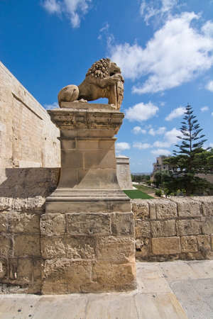 MDINA, MALTA - SEPTEMBER 15, 2015: Guardian lion by the entrance to the old city walls on a sunny day in September 14, 2015 in Mdina, Malta.のeditorial素材