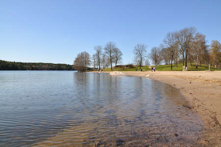 KANAAN, STOCKHOLM, SWEDEN - APRIL 22, 2011: People enjoy first day of spring by empty beach on April 22, 2011 in Stockholm, Sweden.のeditorial素材