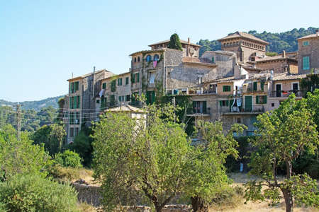 VALLDEMOSSA, MAJORCA, SPAIN - JULY 24, 2015: Residential homes in a sunny afternoon on July 24, 2015 in Valldemossa, Mallorca, Balearic islands, Spain.のeditorial素材