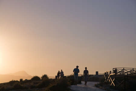MALLORCA, BALEARIC ISLANDS, SPAIN - JULY 21, 2014: People jog and rollerblade along the coast...