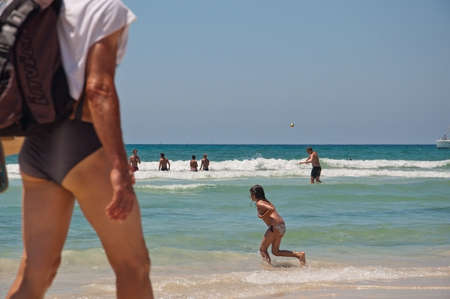 ES TRENC, MALLORCA, SPAIN - JULY 5, 2011: People play in the water on the paradise beach on a sunny summer day on July 5, 2011 in Mallorca, Balearic islands, Spain.のeditorial素材
