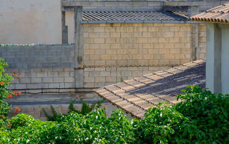 Mallorca roof detail, closeup of tiles and vegetation. Mallorca, Balearic islands, Spain.の写真素材