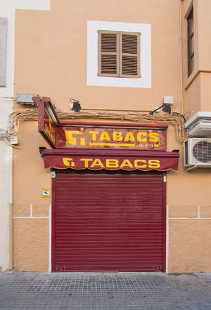 PALMA DE MALLORCA, BALEARIC ISLANDS, SPAIN - DECEMBER 19, 2015: Tabacco store closed for the weekend with red cover on December 19, 2015 in Palma de Mallorca, Balearic islands, Spainのeditorial素材