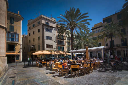 PALMA DE MALLORCA, BALEARIC ISLANDS, SPAIN - APRIL 13, 2016: Outdoor restaurant CafÃÂ© La Lonja on a sunny spring day in Palma de Mallorca, Balearic islands, Spain on April 13, 2016.のeditorial素材