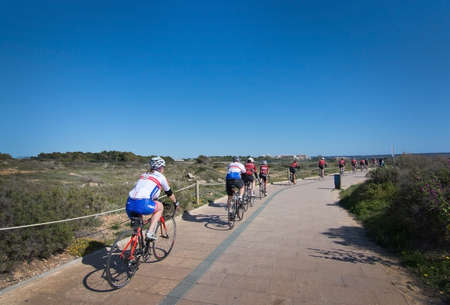 PALMA DE MALLORCA, BALEARIC ISLANDS, SPAIN - APRIL 10, 2016: Group of bicyclists practice through Es...