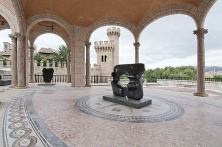 PALMA DE MALLORCA, BALEARIC ISLANDS, SPAIN - JULY 14, 2016: Museu March sculpture garden and neoclassical architecture with a view to Almudaina castle on July 14, 2016 in Palma de Mallorca, Balearic islands, Spain.のeditorial素材