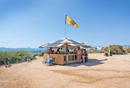 MOLINAR, MALLORCA, BALEARIC ISLANDS, SPAIN - JULY 30, 2016:  Small beach hut cafe along outdoor bicycling track on a sunny day on July 30, 2016 in Palma de Mallorca, Balearic islands, Spain.のeditorial素材