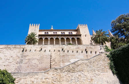 PALMA DE MALLORCA, BALEARIC ISLANDS, SPAIN - APRIL 13, 2016: Almudaina palace and stone wall seen from  Dalt Murada in Palma de Mallorca, Balearic islands, Spain on April 13, 2016.のeditorial素材