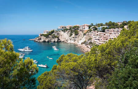 SANTA PONSA, MALLORCA, BALEARIC ISLANDS, SPAIN - SEPTEMBER 3, 2016: Mallorca summer Mediterranean seascape colors with white yachts and Malgrats islets and green vegetation on a sunny summer day on September 3, 2016 in Santa Ponsa, Mallorca, Balearic islaのeditorial素材