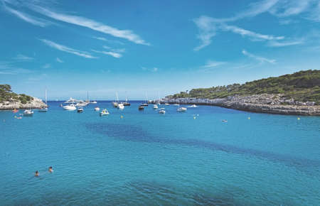 CALA MONDRAGO, MALLORCA, SPAIN - SEPTEMBER 4, 2016: Cala Mondrago and clear turquoise water on a sunny day on September 4, 2016 in Cala Mondrago, Mallorca, Spain.のeditorial素材