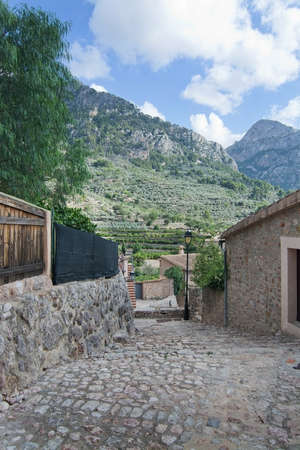 FORNALUTX, MALLORCA, BALEARIC ISLANDS, SPAIN - SEPTEMBER 28, 2016: Fornalutx village stone architecture and decor details on a sunny day on September 28, 2016 in Fornalutx, Mallorca, Balearic islands, Spain.のeditorial素材