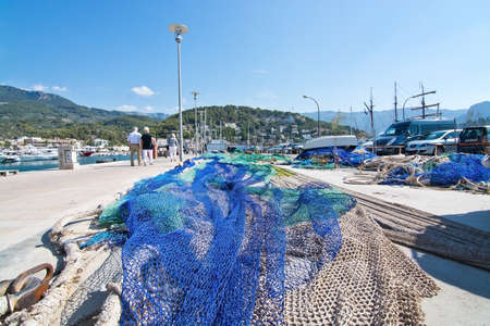 PUERTO SOLLER, MALLORCA, SPAIN - OCTOBER 2, 2016: Fishing nets closeup on a sunny day on October 2, 2016 in Puerto Soller, Mallorca, Spain.のeditorial素材