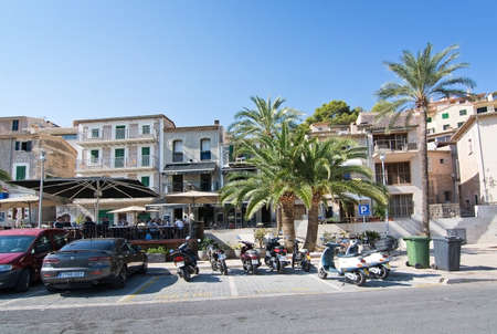 PUERTO SOLLER, MALLORCA, SPAIN - OCTOBER 2, 2016: Parking palms and restaurants on a sunny day on October 2, 2016 in Puerto Soller, Mallorca, Spain.のeditorial素材