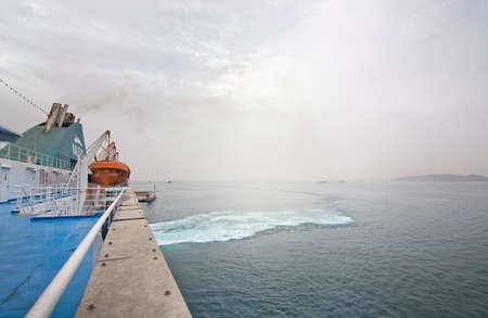 PALMA-IBIZA, BALEARIC ISLANDS, SPAIN - OCTOBER 25, 2016: Green foamy whirls in Mediterranean water on ferry crossing on an overcast day on October 25, 2016 at sea between Palma and Ibiza, Balearic islands, Spain.のeditorial素材