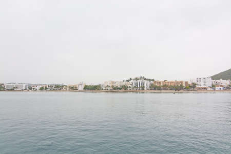 ES CANAR, IBIZA, BALEARIC ISLANDS, SPAIN - OCTOBER 26, 2016: Beach in Es Canar on an overcast day on October 26, 2016 in Ibiza, Balearic islands, Spain.のeditorial素材