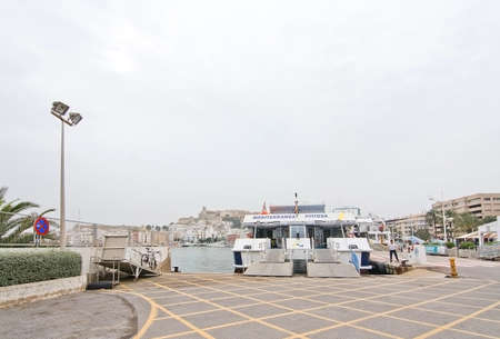 IBIZA, BALEARIC ISLANDS, SPAIN - OCTOBER 25, 2016: Ferry Ibiza-Formentera moored in port on an overcast day on October 25, 2016 in Marina Botafoch, Ibiza, Balearic islands, Spain.のeditorial素材