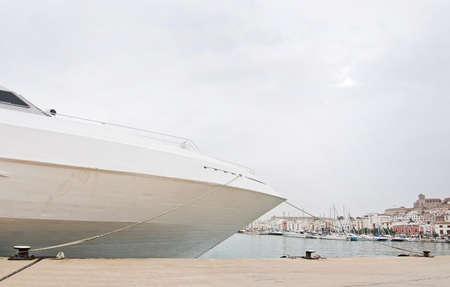Ferry moored in port on an overcast day in Ibiza, Balearic islands, Spain.の写真素材