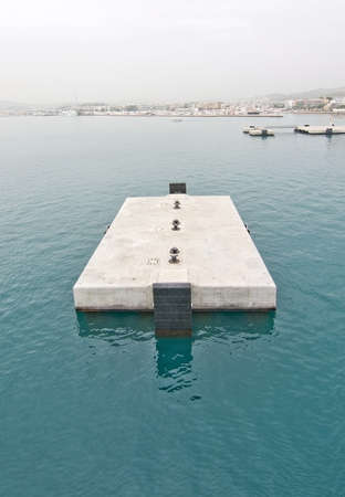 Concrete jetty block in Ibiza port Marina Botafoch in Ibiza, Balearic islands, Spain.の写真素材