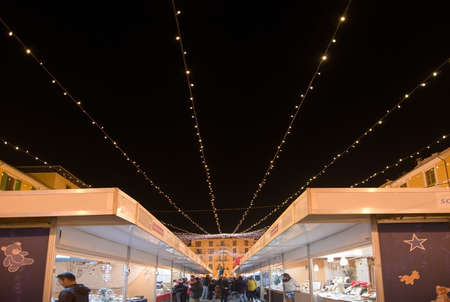 PALMA DE MALLORCA, BALEARIC ISLANDS, SPAIN - DECEMBER 3, 2016: Plaza Mayor Christmas market vendor booths and festive light decorations on December 3, 2016 in Palma de Mallorca, Balearic islands, Spain.のeditorial素材
