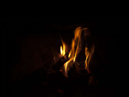 Chimney flames, fire in a chimney on dark background.の写真素材