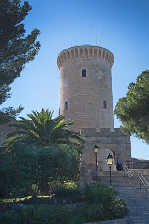 PALMA DE MALLORCA, SPAIN - MARCH 18, 2017: Bellver castle gothic tower from 12th century against blue sky on a sunny day on March 18, 2017 in Palma, Mallorca, Spain.のeditorial素材