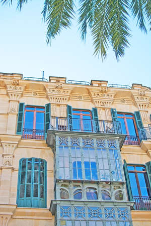 PALMA DE MALLORCA, BALEARIC ISLANDS, SPAIN - MARCH 29, 2017: Beautiful modernisme art nouveau style facade on old Palma residential building on March 29, 2017 in Palma de Mallorca, Balearic islands, Spainのeditorial素材