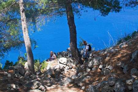 MALLORCA, SPAIN - MAY 15, 2017: People on walking path in landscape in Tramuntana mountains between Soller and Cala Tuent, on May 15, 2017 in Mallorca, Spain.のeditorial素材