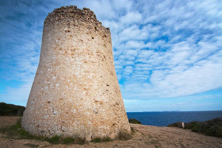 Cala Pi tower and ocean view horizon towards Cabrera island Mallorca, Spain.