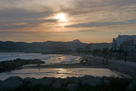 PALMA DE MALLORCA, BALEARIC ISLANDS, SPAIN - JUNE 29, 2017: Sunny evening active people at Molinar beach on a summer evening on June 29, 2017 in Palma de Mallorca, Balearic islands, Spain.のeditorial素材