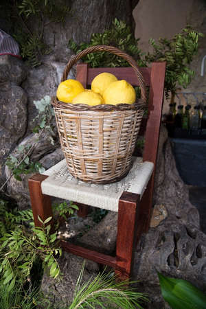 VALLDEMOSSA, BALEARIC ISLANDS, SPAIN - JULY 26, 2017: Lemon basket, details in Valldemossa town on a sunny day on July 26, 2017 in Palma de Mallorca, Balearic islands, Spain.のeditorial素材